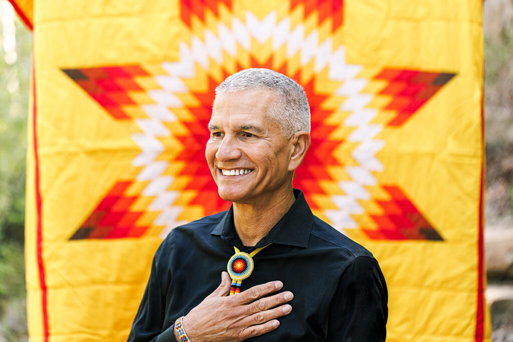 Kerry Bird in front of quilt