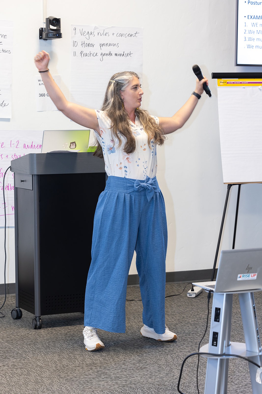 Claudia Romeu presenting at Rise Up office
