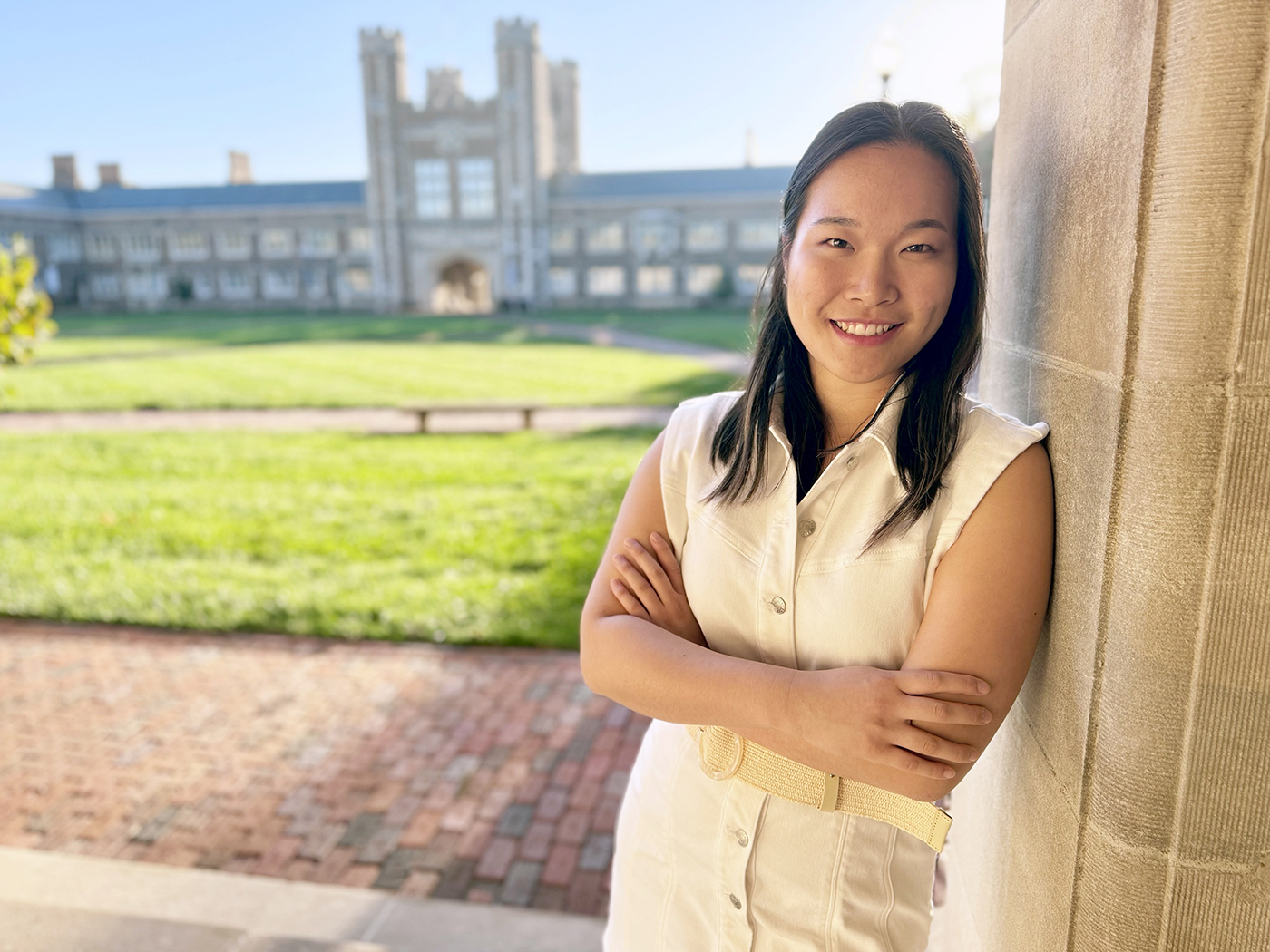 Tiffany Zhu leaning against a column