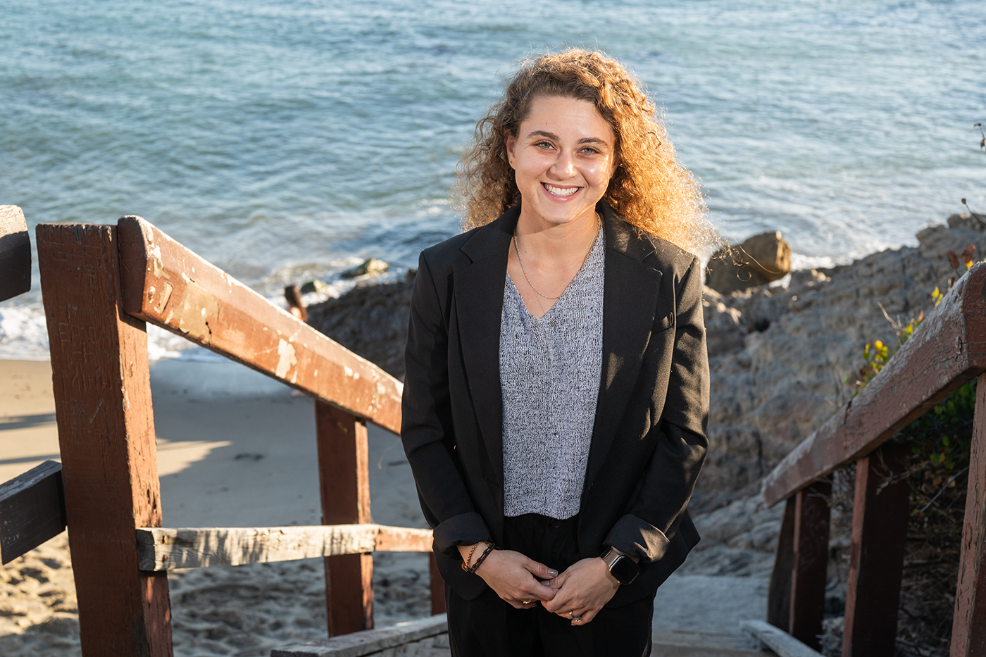Melanie Goldring on the stairs at the beach