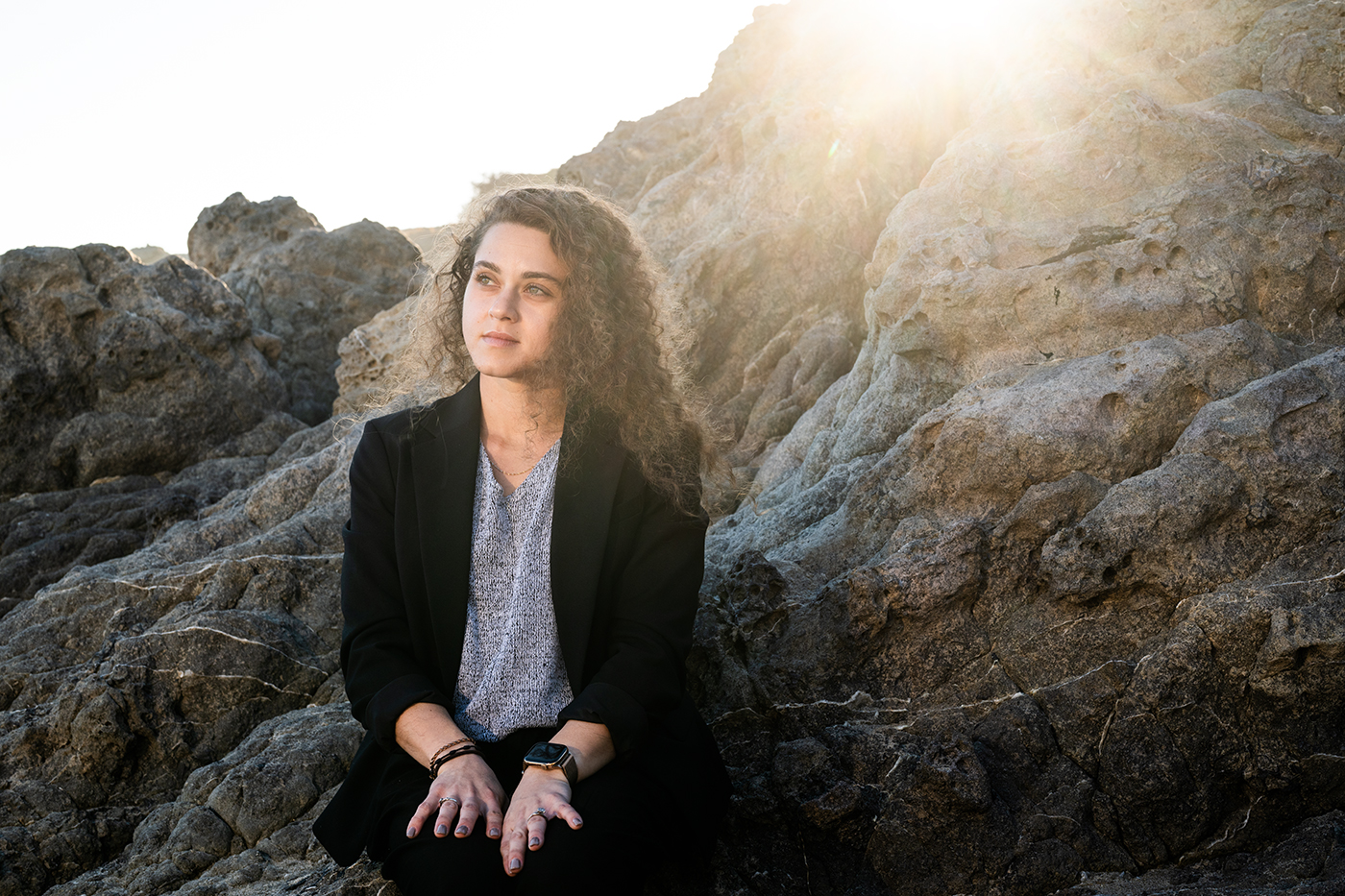 Melanie Goldring sitting on a rock