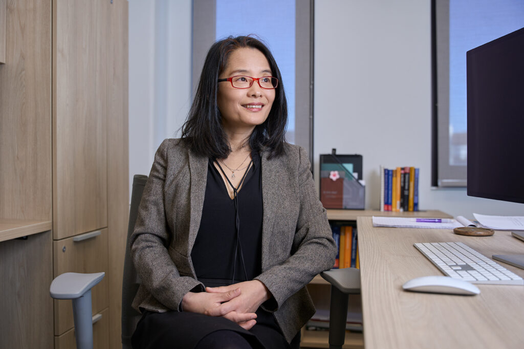 Bo Li at her desk