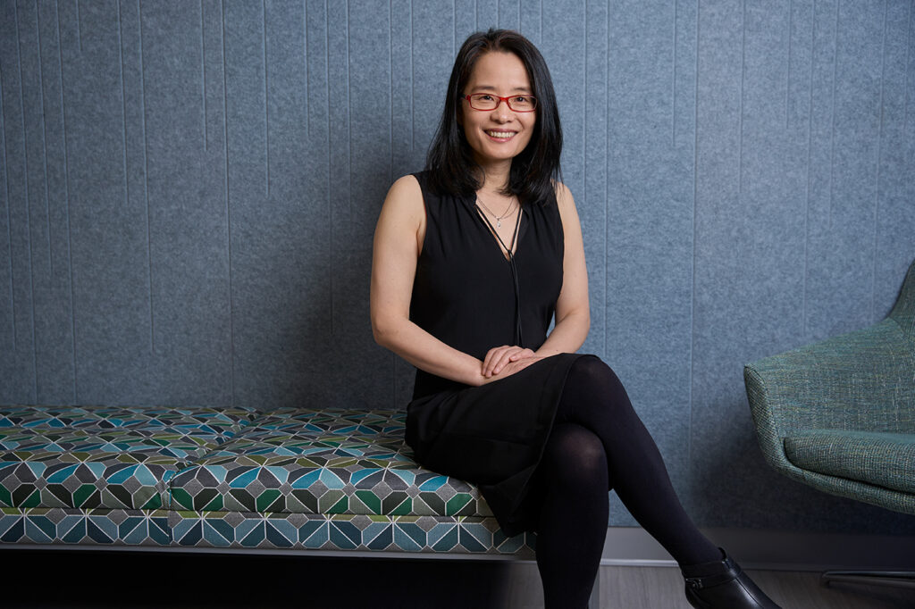 Bo Li sitting on a couch